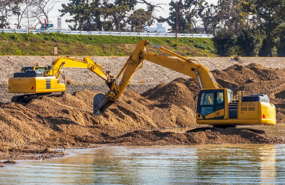 Mass excavation with excavator loading articulated dump truck