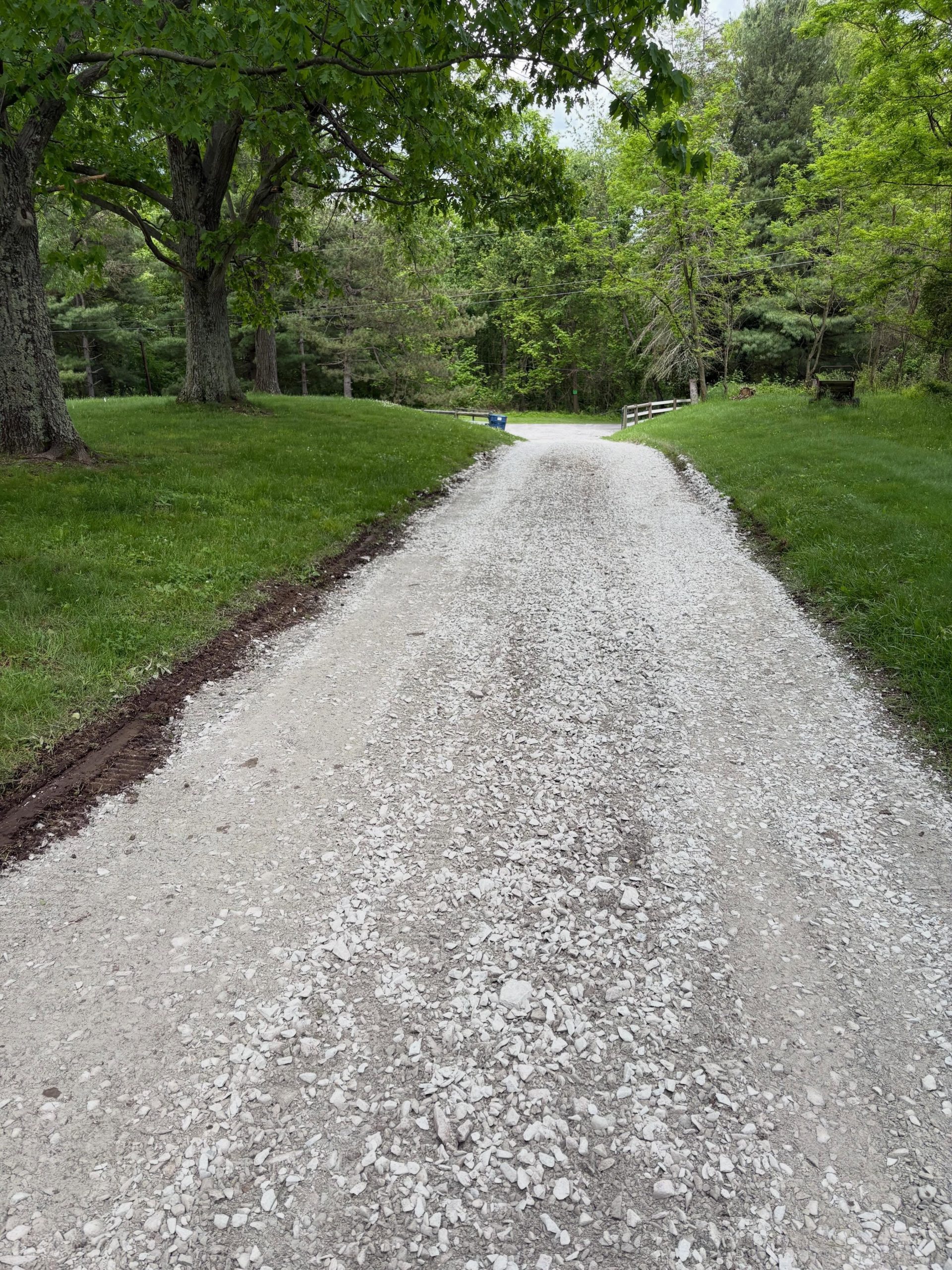 Smooth regraded gravel driveway after restoration